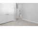 Hallway view showcasing tile flooring, neutral wall paint and access to rooms at 4008 Antelope Ter, North Port, FL 34286