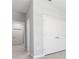 Hallway featuring closet space and views to open rooms of the home at 4008 Antelope Ter, North Port, FL 34286
