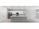 Spacious kitchen with white cabinets, stainless steel appliances, and a central island at 4008 Antelope Ter, North Port, FL 34286