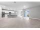Open-concept kitchen with stainless steel appliances, white cabinetry, and a large island at 4008 Antelope Ter, North Port, FL 34286