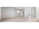 Spacious living room with neutral tones, tile flooring, and ample natural light at 4008 Antelope Ter, North Port, FL 34286