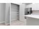 Well-organized pantry with wire shelving and easy access in a bright, modern kitchen at 4008 Antelope Ter, North Port, FL 34286