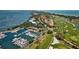 Expansive aerial view showcases waterfront homes, condos, golf course and a marina at 4307 Camino Real, Sarasota, FL 34231