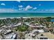 Picturesque aerial view showcasing a charming coastal town and beautiful waterfront at 4307 Camino Real, Sarasota, FL 34231