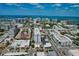 Bustling city aerial view of shopping centers and high rise buildings at 4307 Camino Real, Sarasota, FL 34231