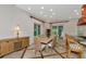 View of dining room set with natural lighting, perfect for Gathering meals and social gatherings at 4307 Camino Real, Sarasota, FL 34231