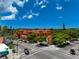 Charming building with vibrant colors, decorative architecture, and lush landscaping at 4307 Camino Real, Sarasota, FL 34231