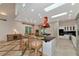 Kitchen featuring a large island, copper range hood, and an open layout perfect for entertaining guests at 4307 Camino Real, Sarasota, FL 34231