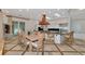 Kitchen with large dining table and kitchen island perfect for Gathering gatherings at 4307 Camino Real, Sarasota, FL 34231
