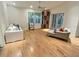 Bright living room with hardwood floors, plenty of natural light, and open space to gather with Gathering and friends at 4307 Camino Real, Sarasota, FL 34231