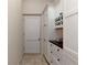 Pantry area with lots of storage cabinets and drawers adjacent to the main kitchen at 4307 Camino Real, Sarasota, FL 34231