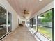 This covered patio with tile floors offers an elegant space for outdoor relaxation and recreation at 4307 Camino Real, Sarasota, FL 34231