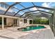Beautiful screened-in pool with attached spa is great for entertaining at 4307 Camino Real, Sarasota, FL 34231