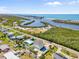 Stunning aerial view of the property with a pool, positioned beautifully near the beach and intercoastal at 4717 Lemon Bay Dr, Venice, FL 34293