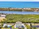 Beautiful aerial shot capturing the home's proximity to the beach, with a pool and coastal views at 4717 Lemon Bay Dr, Venice, FL 34293