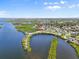 An aerial view highlighting the property's location near the water, mangroves, and a vibrant neighborhood at 4717 Lemon Bay Dr, Venice, FL 34293