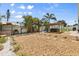 A rock backyard featuring a built-in outdoor grill, covered hot tub, and other outdoor amenities at 4717 Lemon Bay Dr, Venice, FL 34293