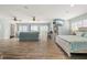 Bright bedroom features wood floors, ceiling fans, waterfront views, and a flat-screen TV at 4717 Lemon Bay Dr, Venice, FL 34293