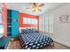 Bright bedroom featuring colorful walls, coastal decor, and a comfortable bed at 4717 Lemon Bay Dr, Venice, FL 34293