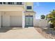 Home exterior showcasing a well-maintained driveway, garage, and attractive front entrance at 4717 Lemon Bay Dr, Venice, FL 34293