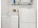 Functional laundry room featuring a modern washer and dryer set, designed for convenience and efficiency at 4717 Lemon Bay Dr, Venice, FL 34293