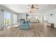 Spacious living area with modern furniture and balcony access at 4717 Lemon Bay Dr, Venice, FL 34293