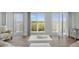 Bright living room with comfortable seating and sliding glass doors to the balcony at 4717 Lemon Bay Dr, Venice, FL 34293