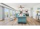 Bright and airy living room with comfortable sofas, a decorative coffee table, and access to an outdoor balcony at 4717 Lemon Bay Dr, Venice, FL 34293