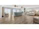 Open-concept living area boasting floor-to-ceiling windows and natural light at 4717 Lemon Bay Dr, Venice, FL 34293