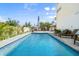 Refreshing pool area with lounge chairs, perfect for relaxation and outdoor enjoyment at 4717 Lemon Bay Dr, Venice, FL 34293