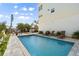 Inviting backyard pool with lounge chairs and outdoor entertaining space at 4717 Lemon Bay Dr, Venice, FL 34293