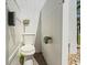 An outdoor toilet with white panels and a gray deck, plus other toilet appliances at 4717 Lemon Bay Dr, Venice, FL 34293