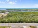 Beautiful water view featuring lush green space and blue skies at 4717 Lemon Bay Dr, Venice, FL 34293