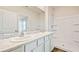 Elegant bathroom featuring double sinks, marble countertops, and a glass-enclosed shower for spa-like experience at 5030 Rocky Coast Pl, Palmetto, FL 34221