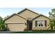 Inviting single-story home with a two-car garage and stone accents at 5030 Rocky Coast Pl, Palmetto, FL 34221