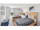 Charming bedroom featuring two twin beds, stylish decor, and a bright, airy ambiance at 5034 Rocky Coast Pl, Palmetto, FL 34221