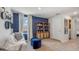 Cozy bonus room with stylish décor, a comfortable sofa, and ample natural light at 5034 Rocky Coast Pl, Palmetto, FL 34221