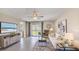 Bright living room with sliding glass doors to the backyard and stylish, contemporary furnishings at 5038 Rocky Coast Pl, Palmetto, FL 34221