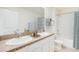 Bathroom featuring a double vanity with stone countertop and a shower-tub combination at 5045 Rocky Coast Pl, Palmetto, FL 34221
