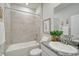 Bathroom featuring a tub-shower combo and a granite countertop vanity with white cabinets at 5282 Grove Mill Loop, Bradenton, FL 34211