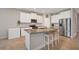 Bright kitchen with stainless steel appliances and granite countertops at 5282 Grove Mill Loop, Bradenton, FL 34211