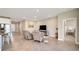 Open-concept living room and kitchen with tile floors at 5282 Grove Mill Loop, Bradenton, FL 34211