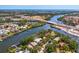 Expansive aerial view of a neighborhood on the water, featuring a bridge and scenic surroundings at 5377 Palos Verdes Dr, Sarasota, FL 34231