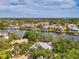 An aerial view captures a house with river access, boasting community charm and a serene location at 5377 Palos Verdes Dr, Sarasota, FL 34231
