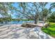 Stunning backyard oasis with deck, mature trees, and water access on the canal at 5377 Palos Verdes Dr, Sarasota, FL 34231