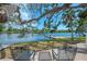 Backyard wooden deck featuring waterfront views and comfortable seating at 5377 Palos Verdes Dr, Sarasota, FL 34231