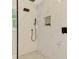 Beautiful bathroom features modern tiling and a built-in shower niche for storage at 5377 Palos Verdes Dr, Sarasota, FL 34231