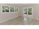 Bright bedroom with tile floors, large windows, and French doors to the outside at 5377 Palos Verdes Dr, Sarasota, FL 34231
