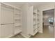 Bright walk-in closet with open shelving offers organized storage solutions with natural light at 5377 Palos Verdes Dr, Sarasota, FL 34231