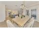 Open dining area features modern lighting and seamless access to the gourmet kitchen, ideal for entertaining at 5377 Palos Verdes Dr, Sarasota, FL 34231